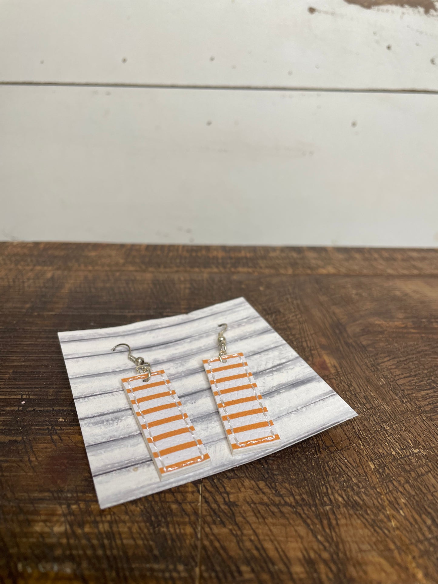 FAUX LEATHER ORANGE AND WHITE STRIPE EARRINGS